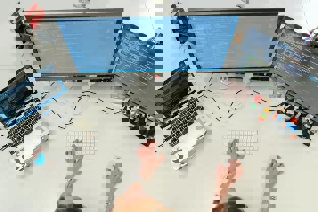 Developer Working On Screens